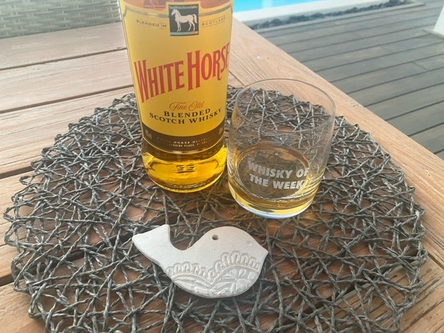 White horse whisky with glass