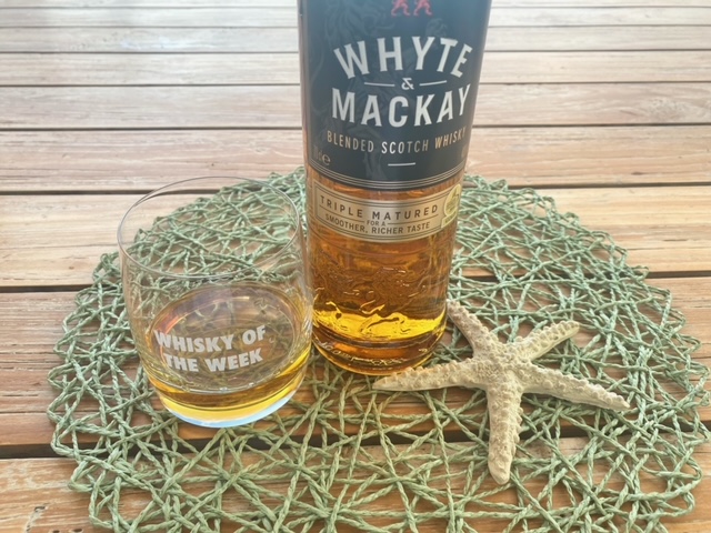 Whyte and Mackay whisky with glass