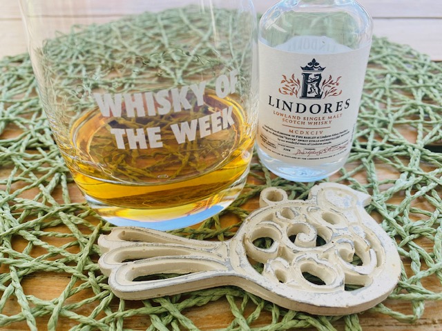 Lindores MCDXCIV whisky with glass