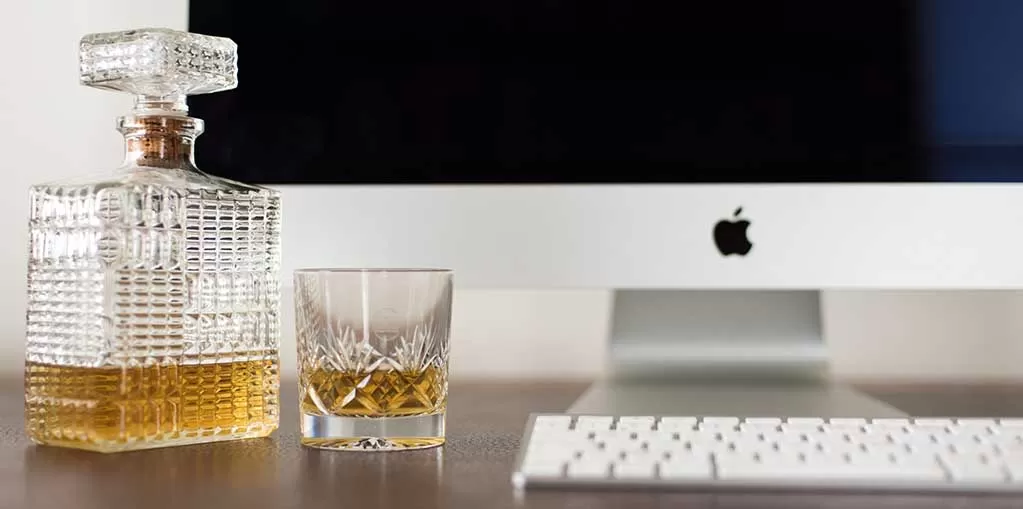 Whisky and a glass with a pc to look at my whisky ratings system