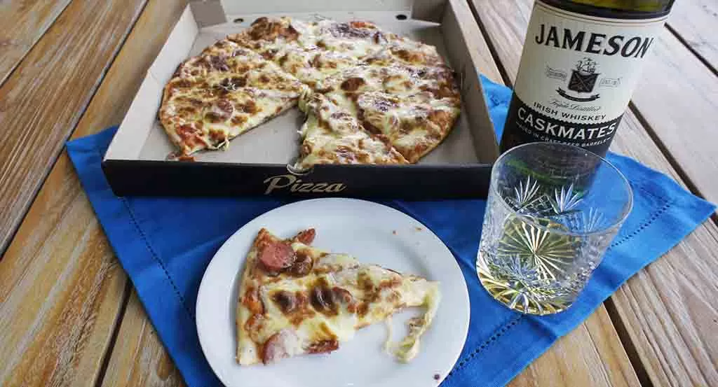 Pizza and whisky pairing Jameson Cask Mates and meaty pizza