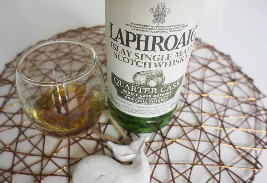 Review and tasting notes Laphroaig Quarter Cask Islay whisky with glass Review and tasting notes Laphroaig Quarter Cask Islay whisky with glass