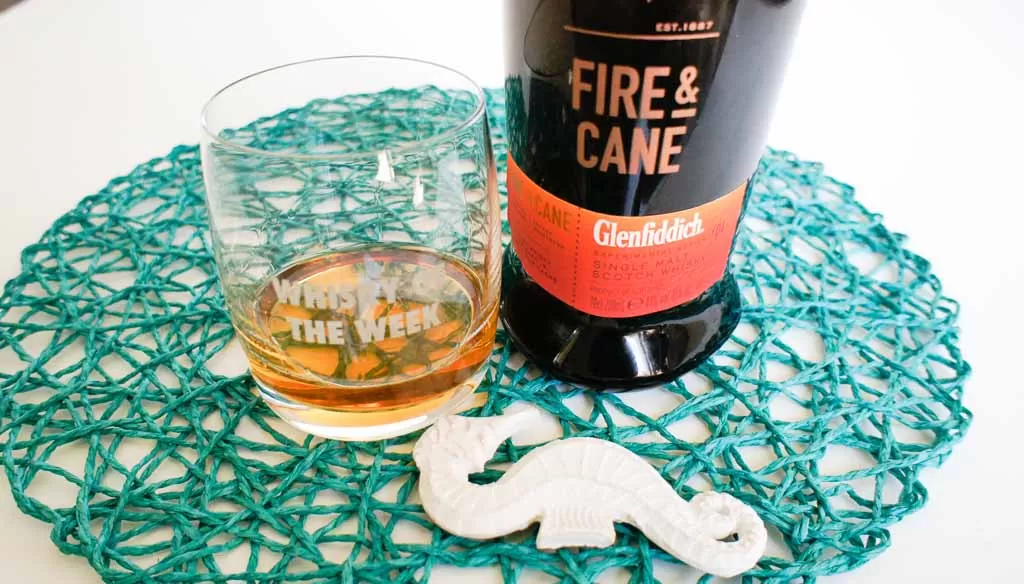 glenfiddich fire and cane whisky with glass