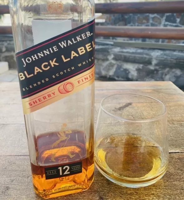 Johnnie Walker Black Label Sherry Finish whisky with glass