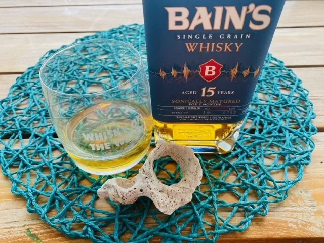 Bains 15 yo sonically matured whisky with glass