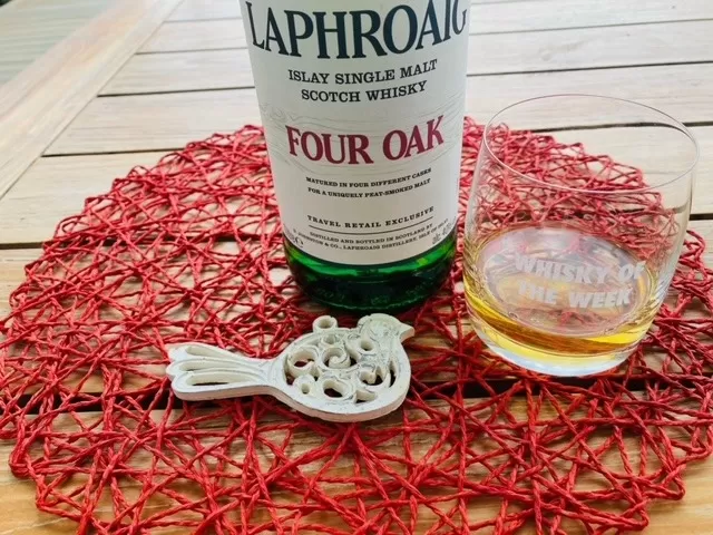 Laphroaig Four Oak whisky with glass