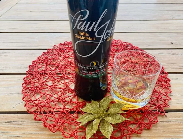 Paul John Christmas Edition 2022 Whisky with glass