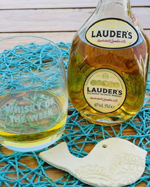 Lauder's blended Scotch whisky with glass