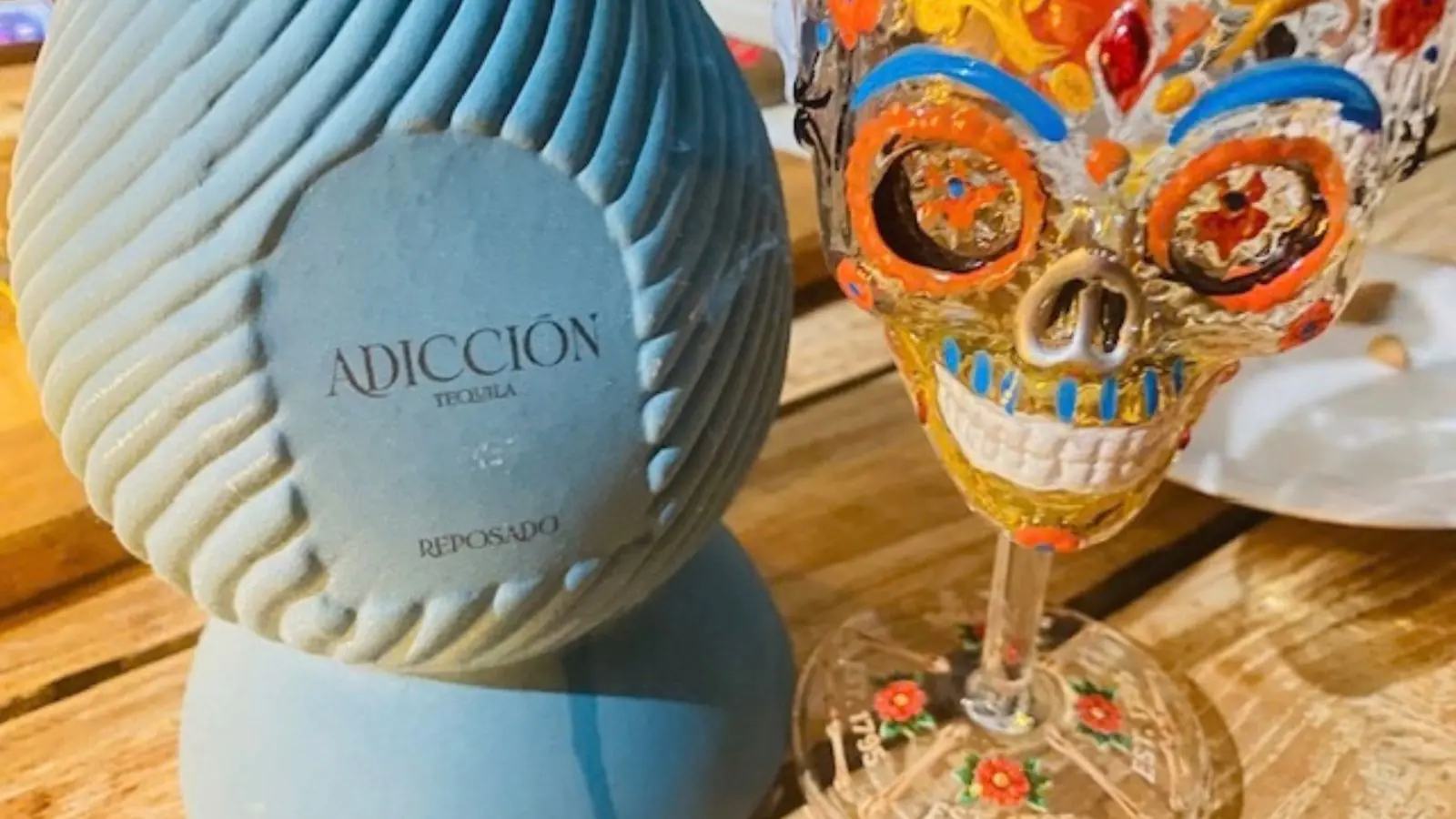 Adiccion Reposado Tequila with glass
